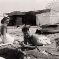Two Young Women Sun Bathing