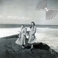 Coated Women On A Rocky Seaside