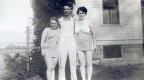 Man In Between Two Women In Bathing Suits