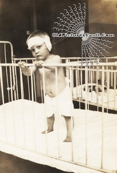 toddler-(initials-N.L.A.)-in-crib-1937.jpg